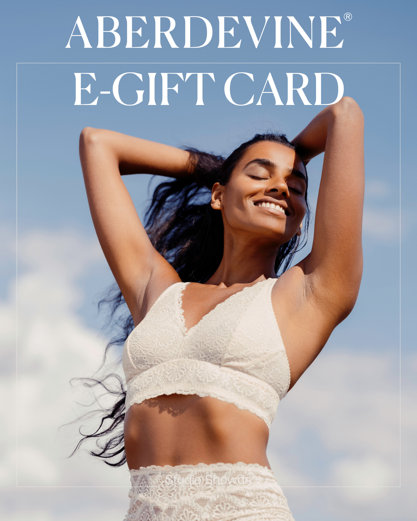image of aberdevine e-gift card with woman in cream lace lingerie set against a blue sky