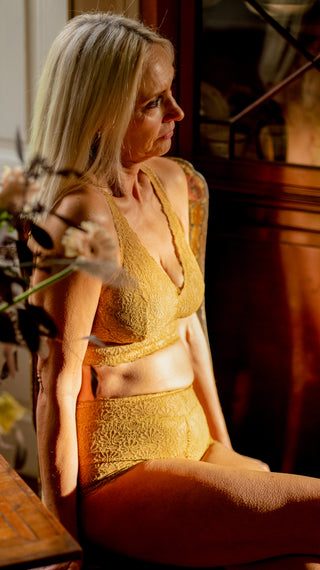 model sat in honey lace supportive bralette and comfy highrise knickers