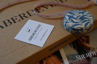 Aberdevine product with a business card on a cardboard box